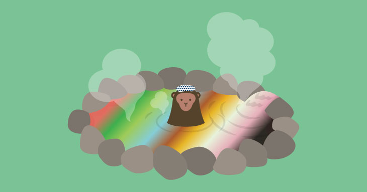虹色の温泉に入る猿